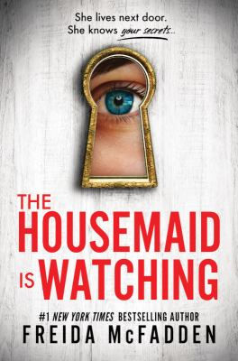 An eye peers through a keyhole. Bold red text reads "The Housemaid is Watching" by Freida McFadden, creating a suspenseful mood.