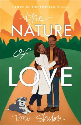 A couple embraces on a path, backed by mountains and a sunset. A small dog sits nearby. Text reads: "The Nature of Love, Toni Shiloh."