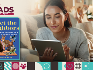 Woman reading a tablet on a couch, with a book cover "Meet the Neighbors" displayed nearby. Warm home setting, Libby app logo visible.