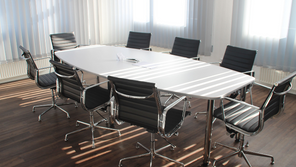 Meeting room with an empty table and chairs