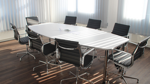 Meeting room with an empty table and chairs