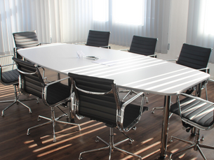 Meeting room with an empty table and chairs