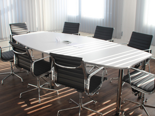 Meeting room with an empty table and chairs
